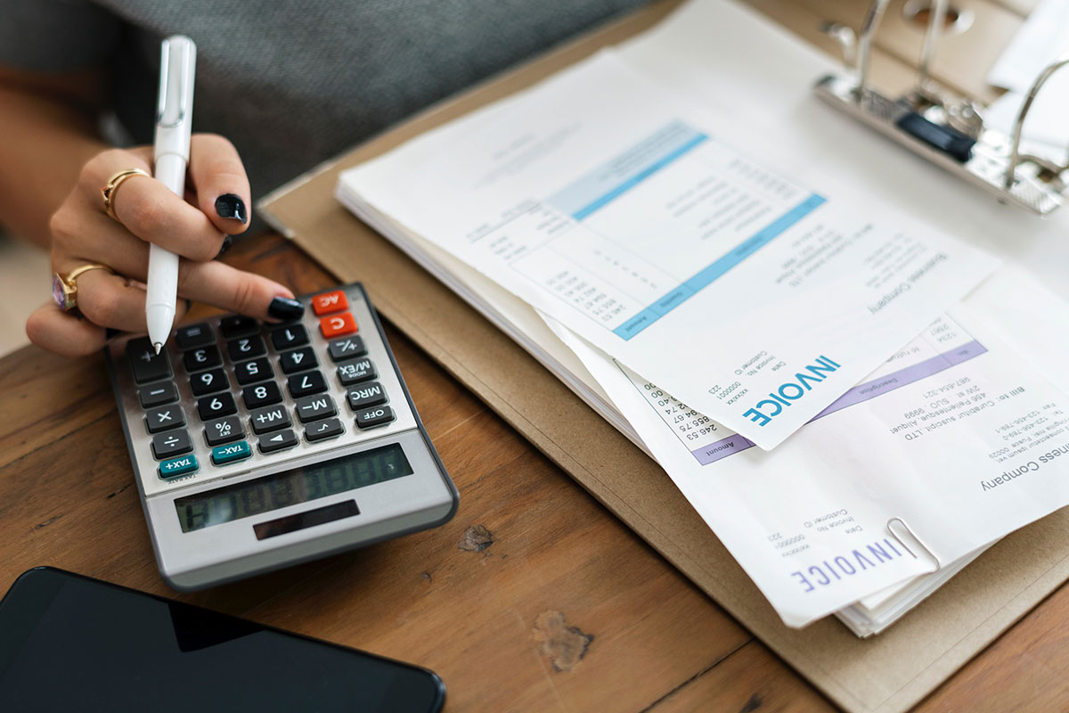 Woman reviewing invoices