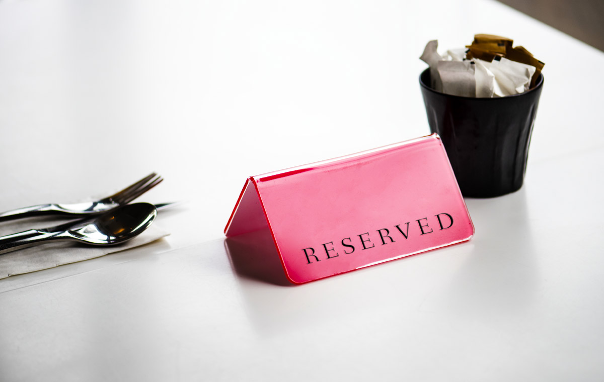 Reserved sign on restaurant table