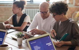 Work colleagues looking at a tablet device