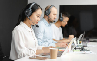 Contact centre team using wireless headsets