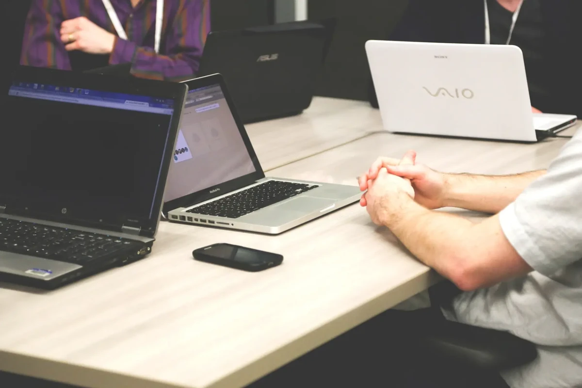 multiple laptops on table