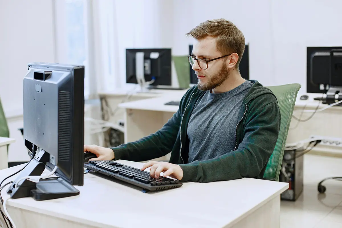 IT worker sat behind PC